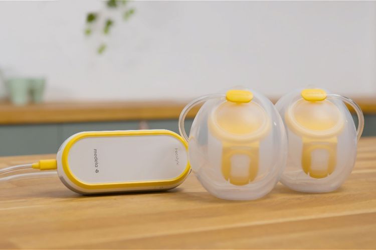 Hands-free breast pump with two cups.